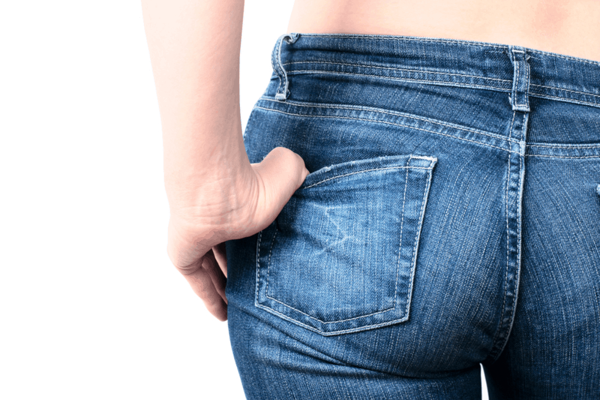 Woman in jeans showing her backside